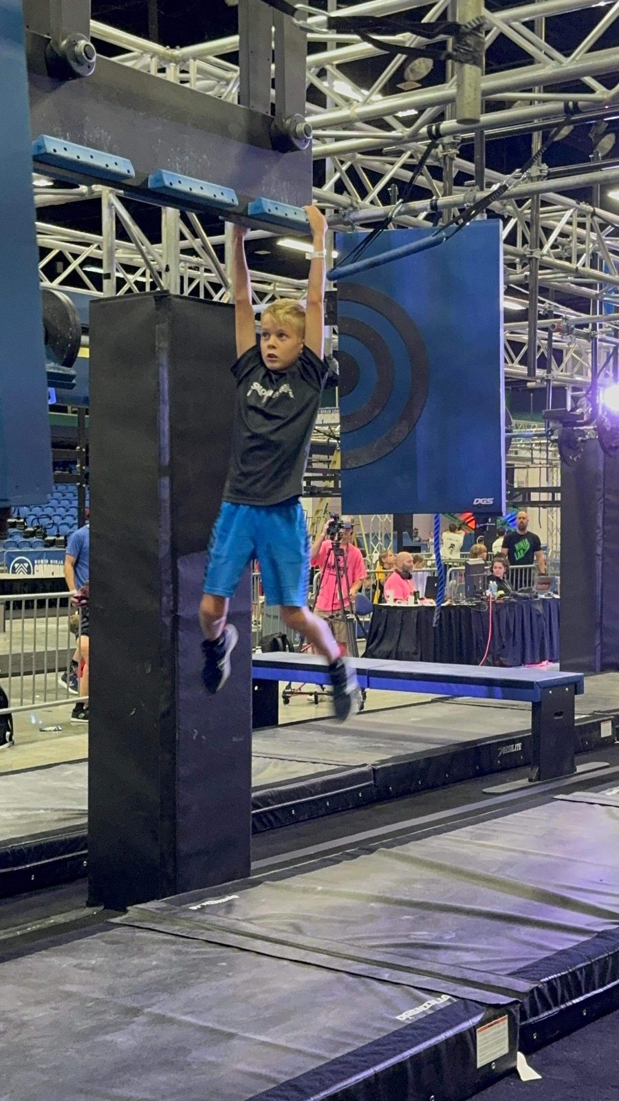 Athlete on the warped wall at the Roseville ninja gym